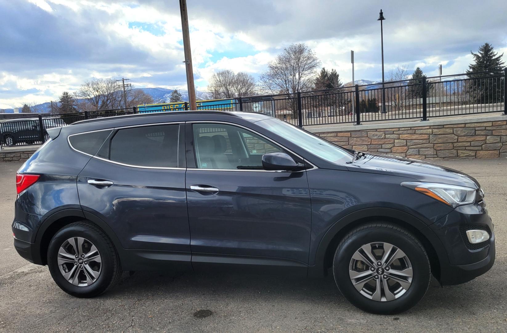 2016 Blue /Tan Hyundai Santa Fe Sport (5XYZUDLB6GG) with an 2.4L I4 engine, 6 Speed Automatic transmission, located at 450 N Russell, Missoula, MT, 59801, (406) 543-6600, 46.874496, -114.017433 - One Owner. Clean Carfax. Heated Seats. Towing. Air. Cruise. Tilt. Backup Camera. Power Windows and Locks. AM FM Bluetooth. - Photo#4